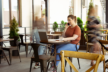 Image showing Caucasian female inclusive plus-size model in her daily routine. Realness, tolerance, lifestyle