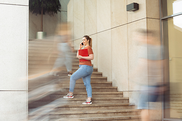 Image showing Caucasian female inclusive plus-size model in her daily routine. Realness, tolerance, lifestyle