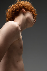 Image showing Portrait of beautiful redhead man isolated on grey studio background. Concept of beauty, skin care, fashion and style