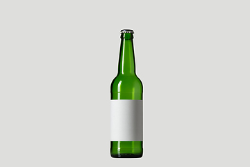 Image showing Empty green colored beer bottle. Isolated on white studio background