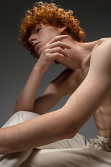 Image showing Portrait of beautiful redhead man isolated on grey studio background. Concept of beauty, skin care, fashion and style