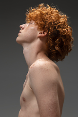 Image showing Portrait of beautiful redhead man isolated on grey studio background. Concept of beauty, skin care, fashion and style