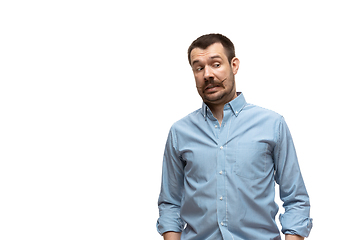 Image showing Young caucasian man with funny, unusual popular emotions and gestures isolated on white studio background