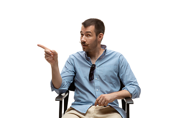 Image showing Young caucasian man with funny, unusual popular emotions and gestures isolated on white studio background