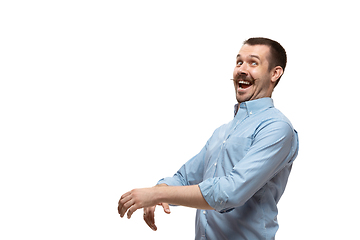 Image showing Young caucasian man with funny, unusual popular emotions and gestures isolated on white studio background