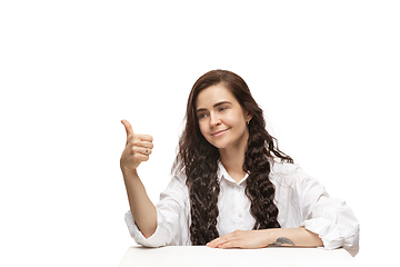 Image showing Young caucasian woman with funny, unusual popular emotions and gestures isolated on white studio background