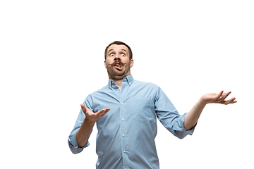 Image showing Young caucasian man with funny, unusual popular emotions and gestures isolated on white studio background