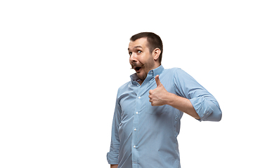 Image showing Young caucasian man with funny, unusual popular emotions and gestures isolated on white studio background