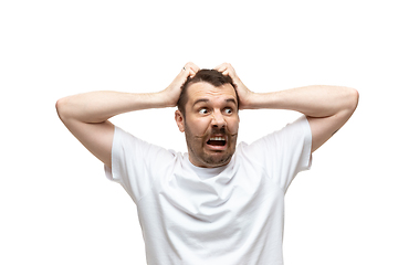 Image showing Young caucasian man with funny, unusual popular emotions and gestures isolated on white studio background