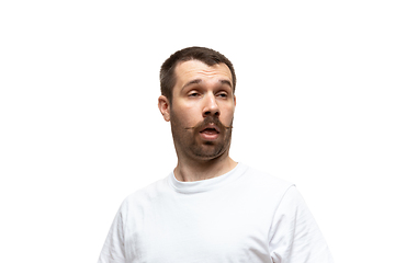 Image showing Young caucasian man with funny, unusual popular emotions and gestures isolated on white studio background