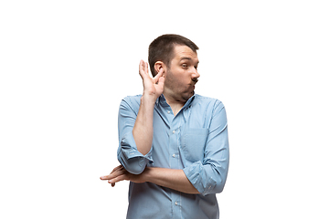 Image showing Young caucasian man with funny, unusual popular emotions and gestures isolated on white studio background