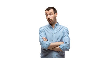 Image showing Young caucasian man with funny, unusual popular emotions and gestures isolated on white studio background