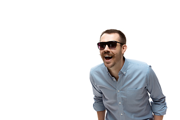 Image showing Young caucasian man with funny, unusual popular emotions and gestures isolated on white studio background