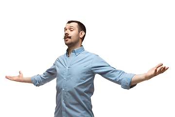 Image showing Young caucasian man with funny, unusual popular emotions and gestures isolated on white studio background