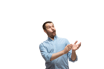 Image showing Young caucasian man with funny, unusual popular emotions and gestures isolated on white studio background