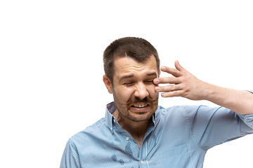 Image showing Young caucasian man with funny, unusual popular emotions and gestures isolated on white studio background