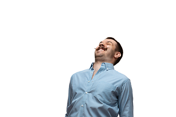 Image showing Young caucasian man with funny, unusual popular emotions and gestures isolated on white studio background