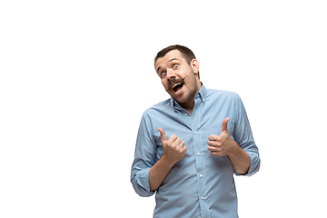 Image showing Young caucasian man with funny, unusual popular emotions and gestures isolated on white studio background