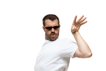 Image showing Young caucasian man with funny, unusual popular emotions and gestures isolated on white studio background