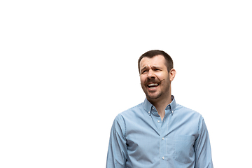 Image showing Young caucasian man with funny, unusual popular emotions and gestures isolated on white studio background