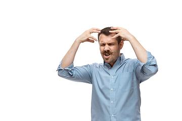 Image showing Young caucasian man with funny, unusual popular emotions and gestures isolated on white studio background