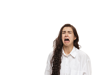 Image showing Young caucasian woman with funny, unusual popular emotions and gestures isolated on white studio background