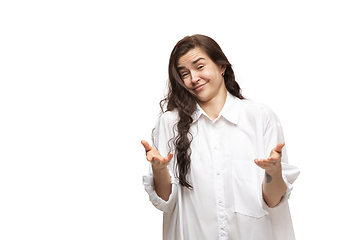 Image showing Young caucasian woman with funny, unusual popular emotions and gestures isolated on white studio background