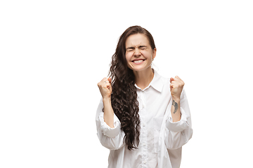 Image showing Young caucasian woman with funny, unusual popular emotions and gestures isolated on white studio background