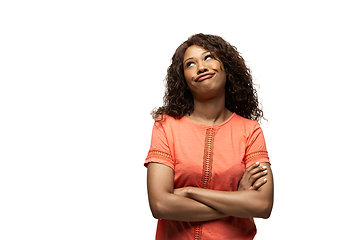 Image showing Young african-american woman with funny, unusual popular emotions and gestures isolated on white studio background