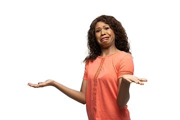 Image showing Young african-american woman with funny, unusual popular emotions and gestures isolated on white studio background