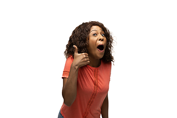 Image showing Young african-american woman with funny, unusual popular emotions and gestures isolated on white studio background