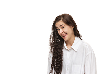 Image showing Young caucasian woman with funny, unusual popular emotions and gestures isolated on white studio background