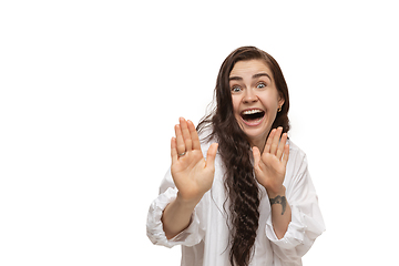 Image showing Young caucasian woman with funny, unusual popular emotions and gestures isolated on white studio background