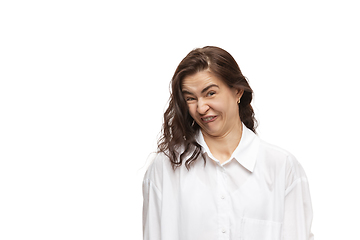 Image showing Young caucasian woman with funny, unusual popular emotions and gestures isolated on white studio background