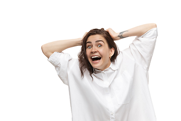 Image showing Young caucasian woman with funny, unusual popular emotions and gestures isolated on white studio background