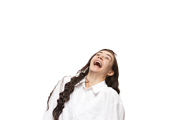 Image showing Young caucasian woman with funny, unusual popular emotions and gestures isolated on white studio background