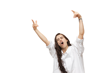 Image showing Young caucasian woman with funny, unusual popular emotions and gestures isolated on white studio background