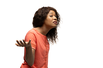 Image showing Young african-american woman with funny, unusual popular emotions and gestures isolated on white studio background