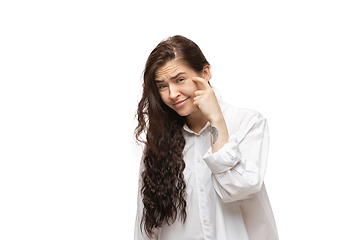 Image showing Young caucasian woman with funny, unusual popular emotions and gestures isolated on white studio background