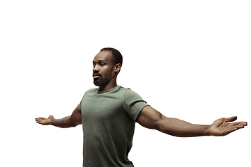 Image showing Young african-american man with funny, unusual popular emotions and gestures isolated on white studio background