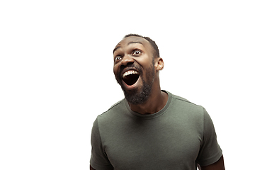 Image showing Young african-american man with funny, unusual popular emotions and gestures isolated on white studio background