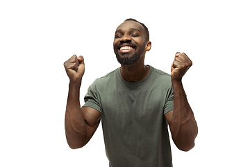 Image showing Young african-american man with funny, unusual popular emotions and gestures isolated on white studio background