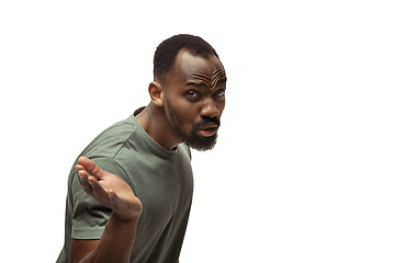 Image showing Young african-american man with funny, unusual popular emotions and gestures isolated on white studio background