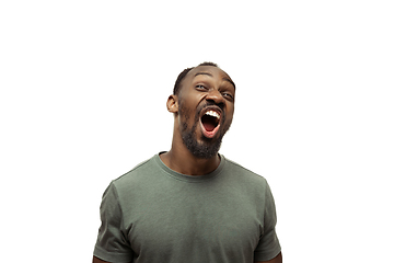 Image showing Young african-american man with funny, unusual popular emotions and gestures isolated on white studio background