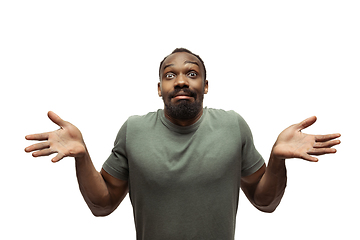 Image showing Young african-american man with funny, unusual popular emotions and gestures isolated on white studio background