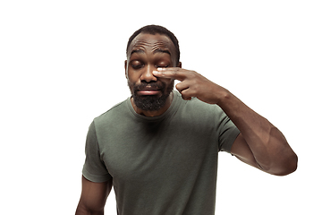 Image showing Young african-american man with funny, unusual popular emotions and gestures isolated on white studio background