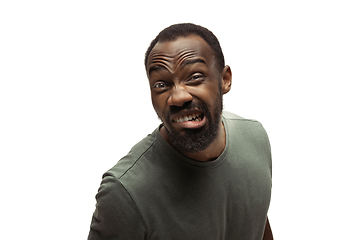 Image showing Young african-american man with funny, unusual popular emotions and gestures isolated on white studio background