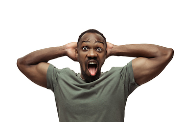 Image showing Young african-american man with funny, unusual popular emotions and gestures isolated on white studio background