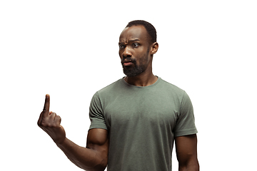 Image showing Young african-american man with funny, unusual popular emotions and gestures isolated on white studio background