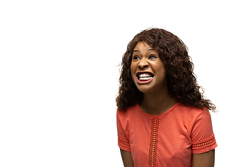 Image showing Young african-american woman with funny, unusual popular emotions and gestures isolated on white studio background